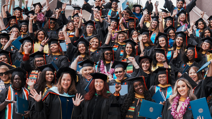 Big group of UMass Global Graduates