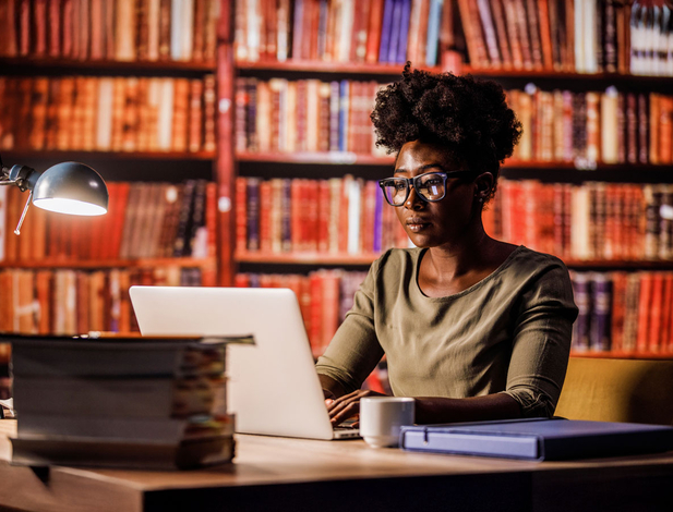 Lawyer doing research in a library