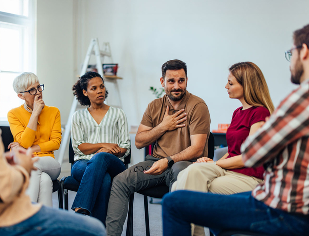 Counselor talking to a group of people