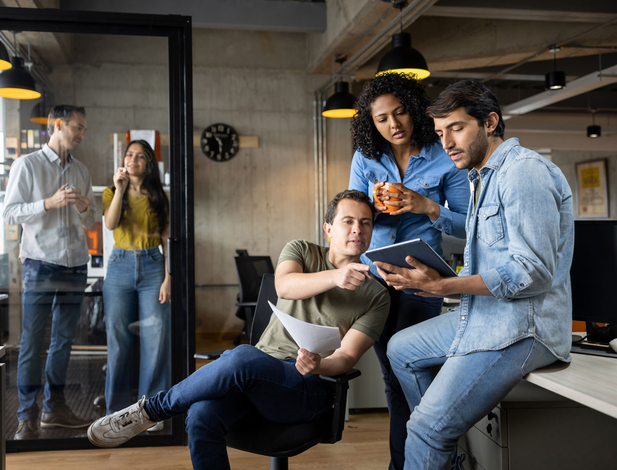 Team collaborating on a laptop