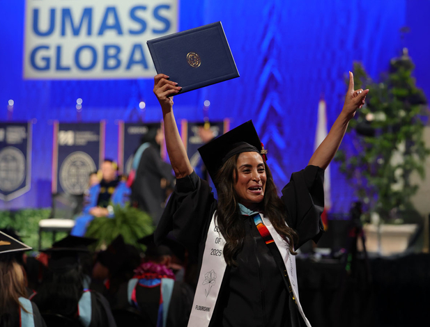 Graduating student cheering