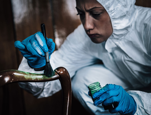 Crime scene investigator finger print dusting