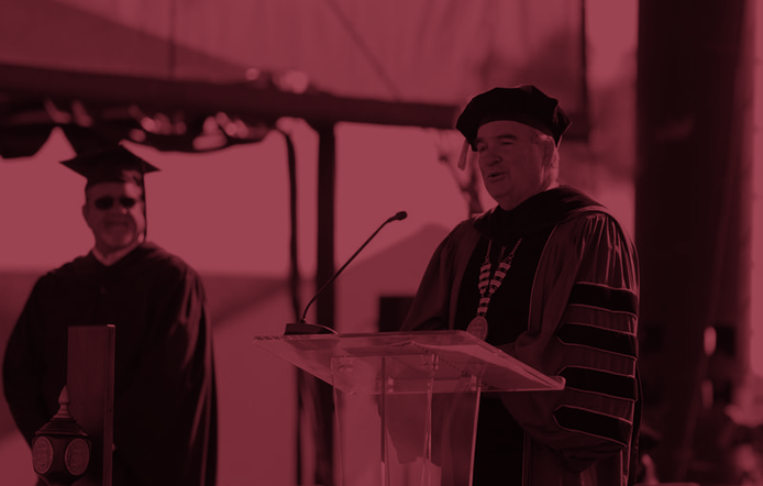 Chancellor Andrews speaking at commencement.
